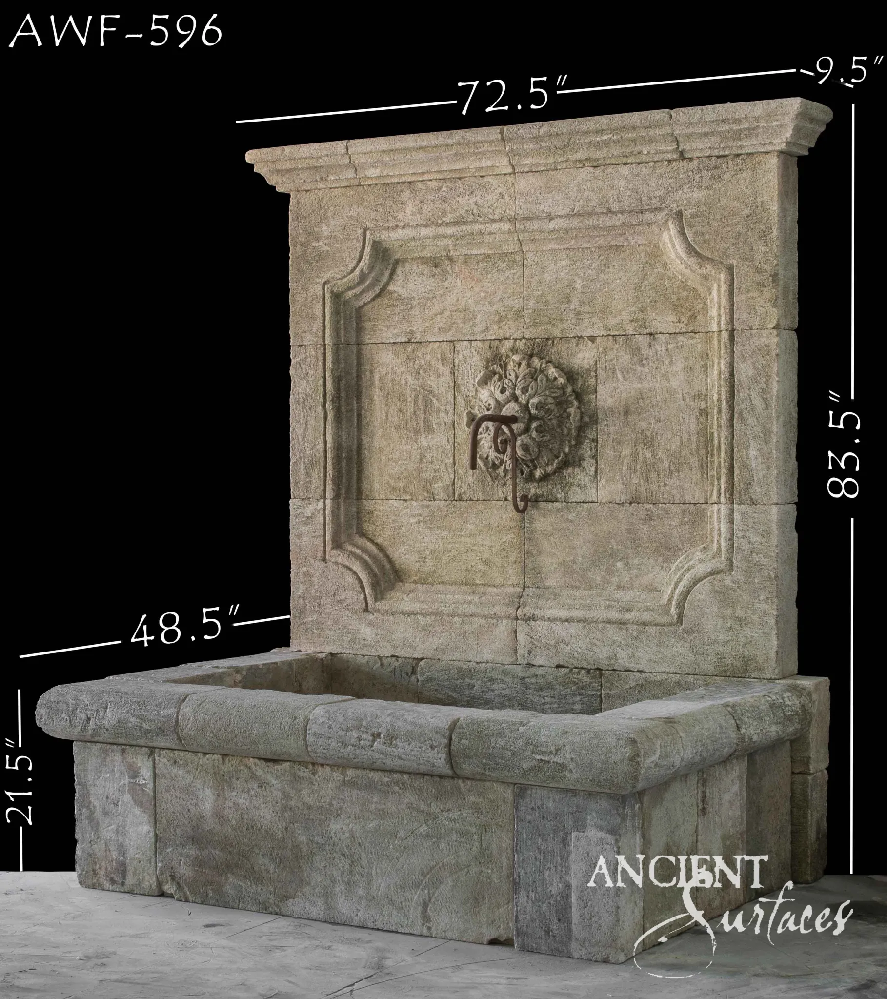 Large reclaimed antique limestone wall fountain from Ancient Surfaces with a carved rosette boss, iron spout and rectangular block basin